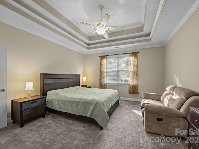 8657 Sonata Court, Denver, NC 28037.  MLS# CAR4321680, YatesRealty ID 690. Primary bedroom w/ triple tray ceiling