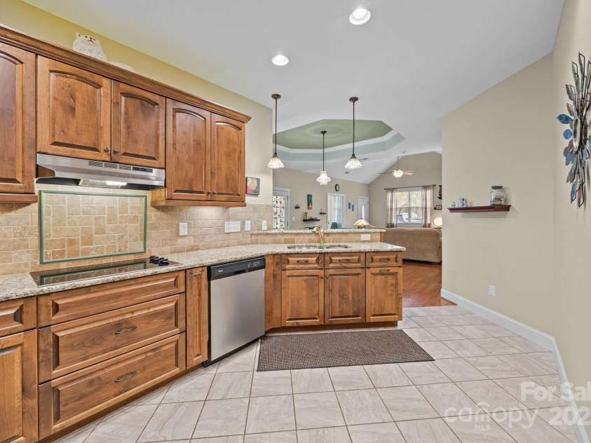 8657 Sonata Court, Denver, NC 28037.  MLS# CAR4321680, YatesRealty ID 690. Roll out shelving in the lower cabinets, drawer stack, spice roll out & so much more