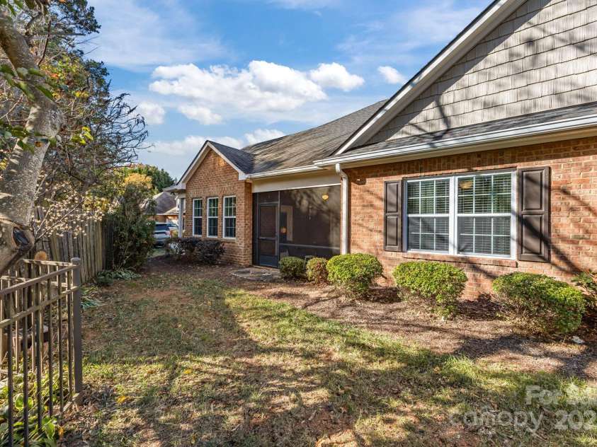 8657 Sonata Court, Denver, NC 28037.  MLS# CAR4321680, YatesRealty ID 690. Side view looking at screened porch