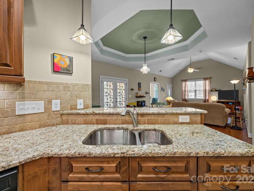8657 Sonata Court, Denver, NC 28037.  MLS# CAR4321680, YatesRealty ID 690. Sink overlooks the dining area and living room