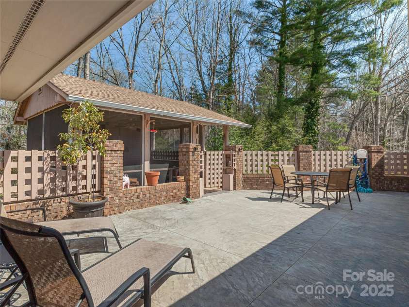 34 Glen Crest Drive, Arden, NC 28704.  MLS# CAR4238682, YatesRealty ID 6900. Stamped concrete patio