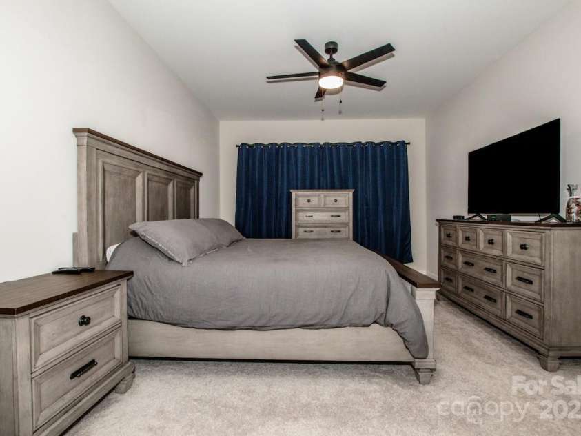 1270 Brawley School Road, Mooresville, NC 28117.  MLS# CAR4318407, YatesRealty ID 6902. Primary Bedroom with Ceiling fan 