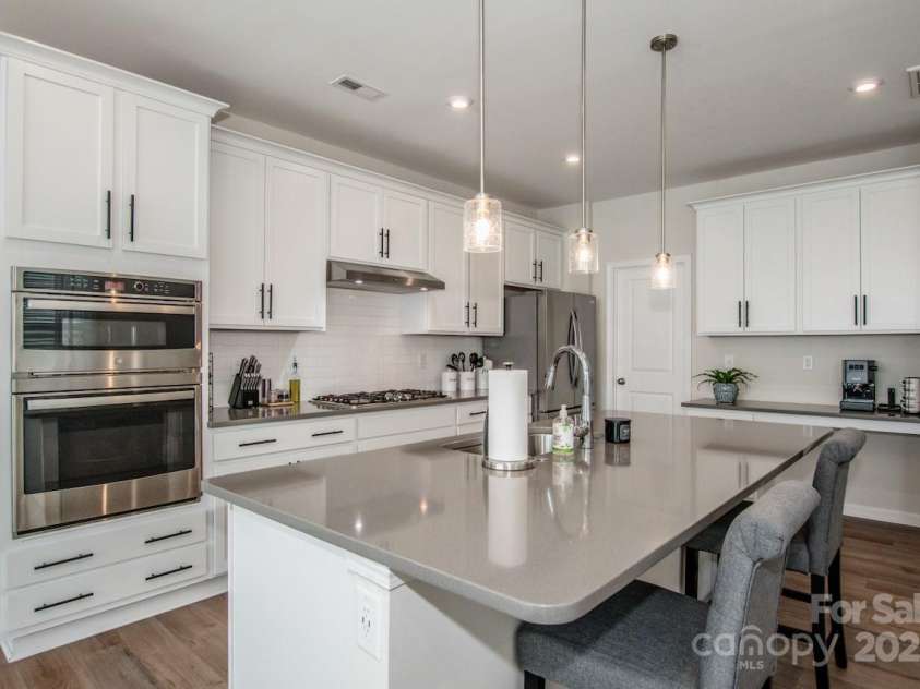 1270 Brawley School Road, Mooresville, NC 28117.  MLS# CAR4318407, YatesRealty ID 6902. Upgraded Gourmet Kitchen w/ stainless Counter depth Refrigerator & Ice maker