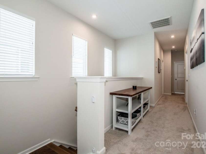 1270 Brawley School Road, Mooresville, NC 28117.  MLS# CAR4318407, YatesRealty ID 6902. Upstairs Hallway 