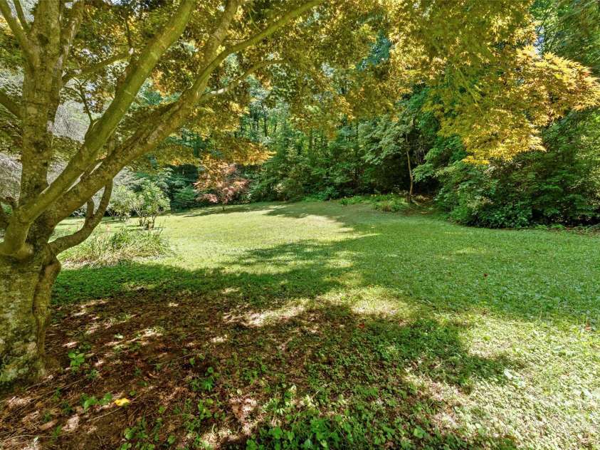 240+ and 252 General Hill Road, Flat Rock, NC 28731.  MLS# CAR4234844, YatesRealty ID 6906. Beautiful forest lawn near Beck creek.