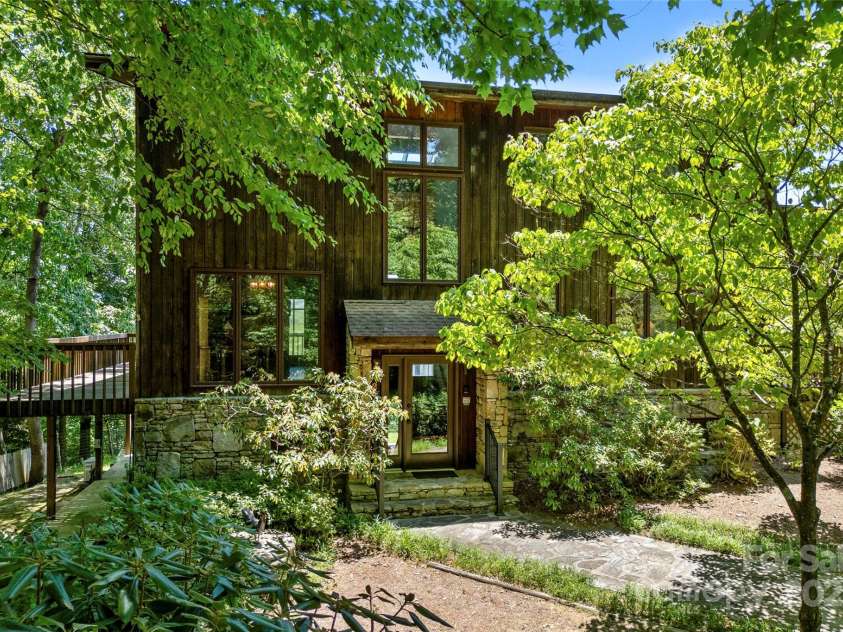 240+ and 252 General Hill Road, Flat Rock, NC 28731.  MLS# CAR4234844, YatesRealty ID 6906. Home features a modern design and is accented by mature landscaping and azaleas.