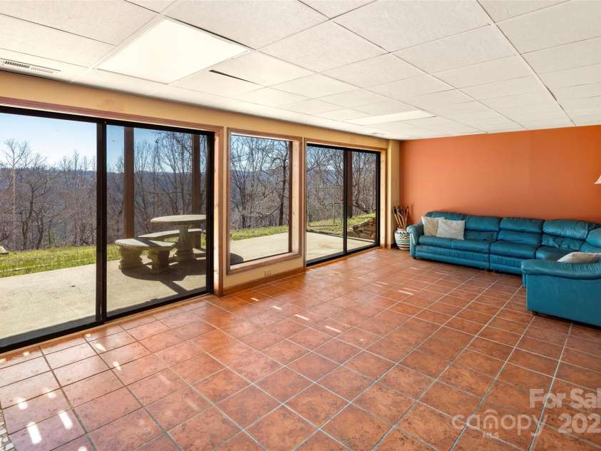 240+ and 252 General Hill Road, Flat Rock, NC 28731.  MLS# CAR4234844, YatesRealty ID 6906. Open space in lower level for gatherings, family and friends.
