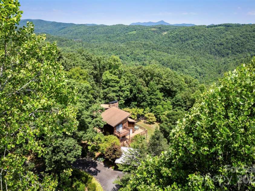 240+ and 252 General Hill Road, Flat Rock, NC 28731.  MLS# CAR4234844, YatesRealty ID 6906. Surrounded by privacy and nature, yet only 10-15 minutes to Saluda or Hendersonville. Very convenient to Greenville or Spartanburg.