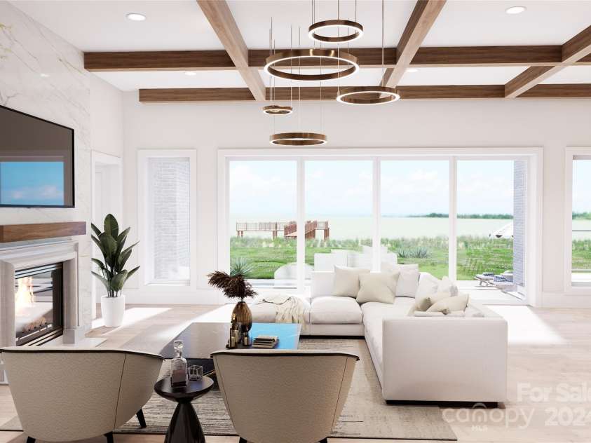 108 Sail High Court, Mooresville, NC 28117.  MLS# CAR4147056, YatesRealty ID 6915. Step in through the foyer into this breathtaking great room boasting abundant lake views and wood beam accents.