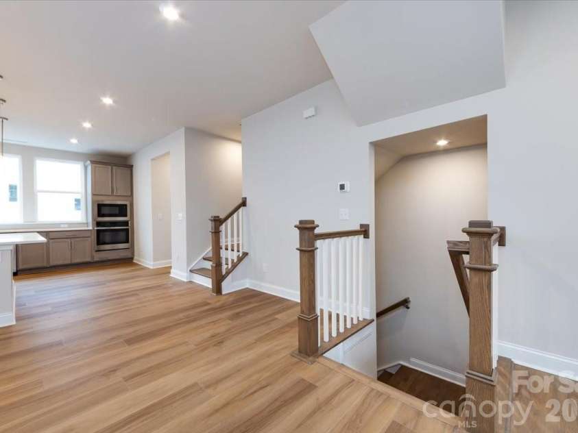 8022 Cedarsmith Court, Charlotte, NC 28217.  MLS# CAR4353026, YatesRealty ID 6915. Second Floor Landing with Open Rails