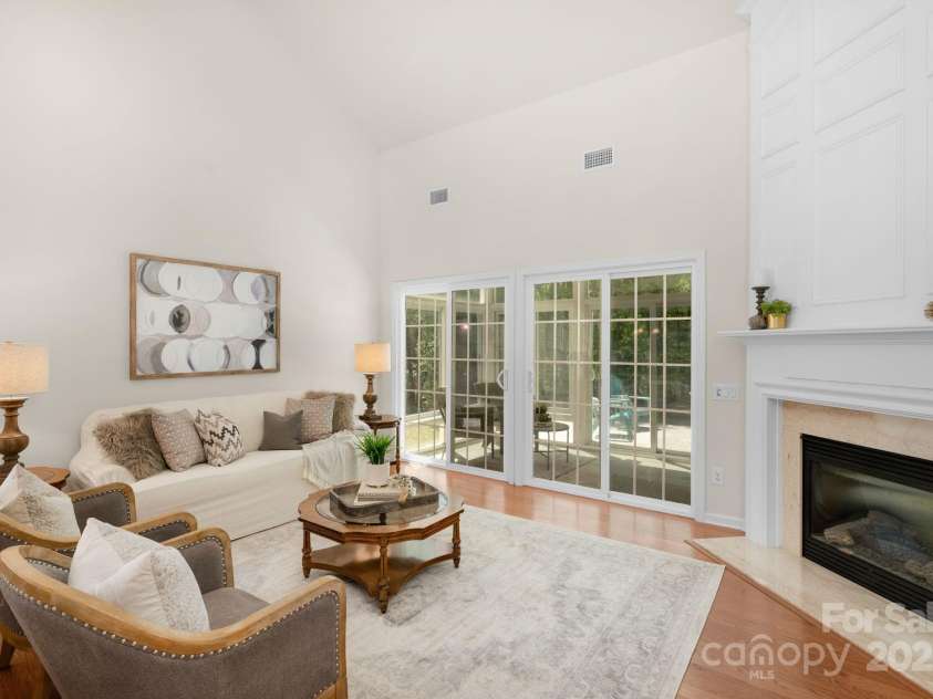 2136 Ashley River Road, Waxhaw, NC 28173.  MLS# CAR4243691, YatesRealty ID 6919. 2 story great room with gas fireplace and sliding door access to the sunroom