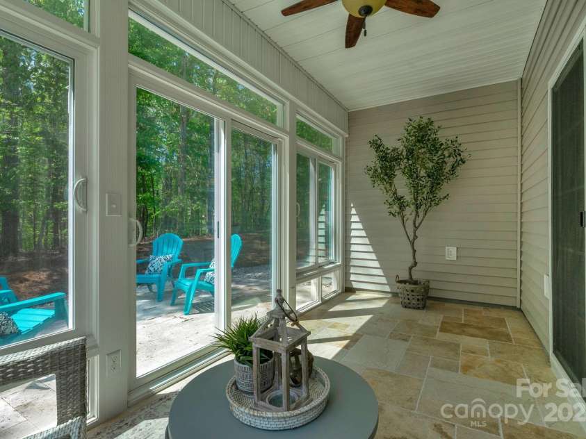 2136 Ashley River Road, Waxhaw, NC 28173.  MLS# CAR4243691, YatesRealty ID 6919. Fabulous sunroom built by Champion with Travertine tile