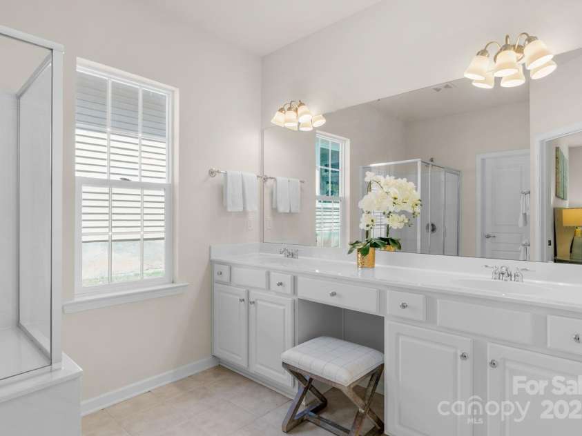 2136 Ashley River Road, Waxhaw, NC 28173.  MLS# CAR4243691, YatesRealty ID 6919. Primary bathroom with shower, double sink vanity with sitting area