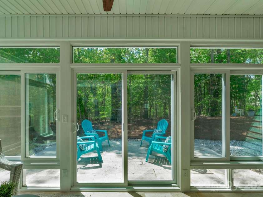 2136 Ashley River Road, Waxhaw, NC 28173.  MLS# CAR4243691, YatesRealty ID 6919. Sunroom with access to the Travertine patio