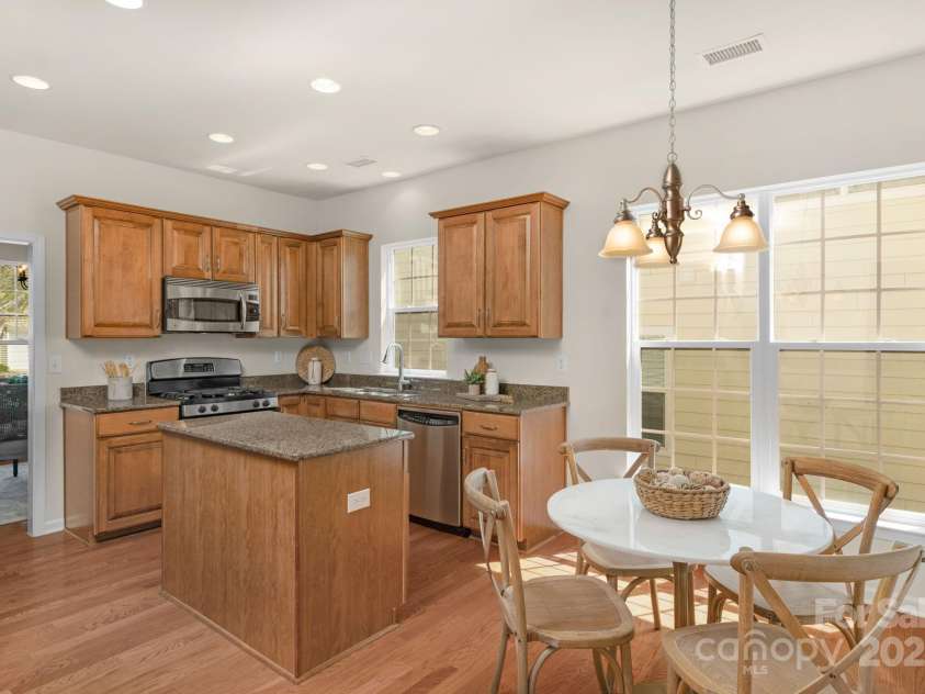 2136 Ashley River Road, Waxhaw, NC 28173.  MLS# CAR4243691, YatesRealty ID 6919. Well-equipped kitchen with granite counters, island, pantry & stainless appliances