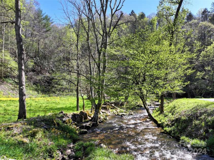 2180 Pigeon Roost Road, Green Mountain, NC 28740.  MLS# CAR4137054, YatesRealty ID 693. Pigeon Roost Creek