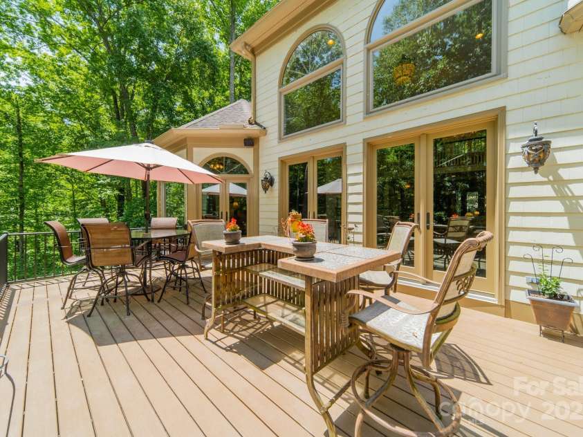 1090 Saunders Drive, Catawba, NC 28609.  MLS# CAR4212702, YatesRealty ID 6931. Expansive main level deck overlooking the pool nestled among the trees