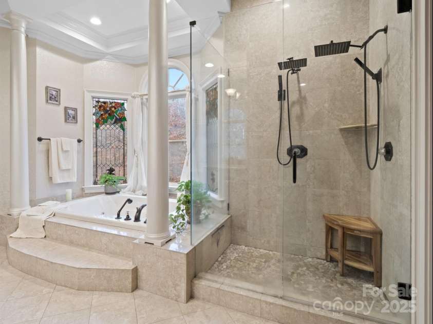 1090 Saunders Drive, Catawba, NC 28609.  MLS# CAR4325668, YatesRealty ID 6931. In the primary bath, you’ll find a spacious tile shower with dual heads, a soaking tub accented by graceful columns, and a double vanity with custom cabinets.