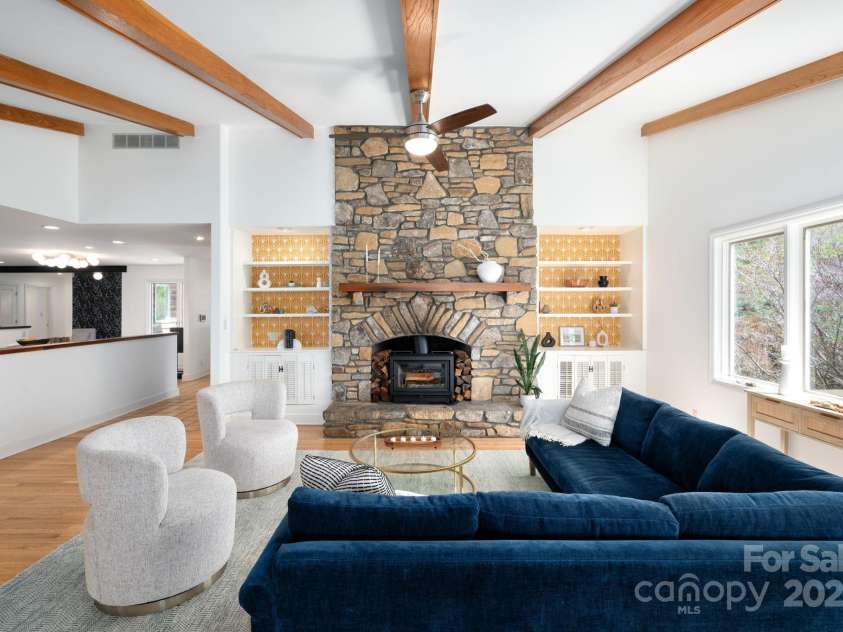 4 Blackberry Lane, Asheville, NC 28804.  MLS# CAR4244505, YatesRealty ID 6939. Floor-to-ceiling Stone Fireplace with Woodburning Stove
