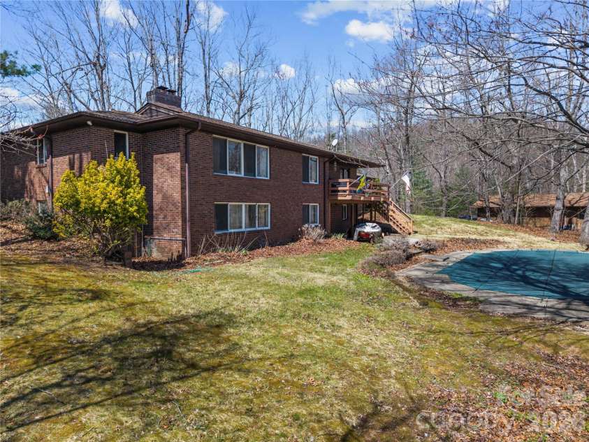 1086 Mine Gap Road, Zirconia, NC 28790.  MLS# CAR4361946, YatesRealty ID 6943. Backyard and pool