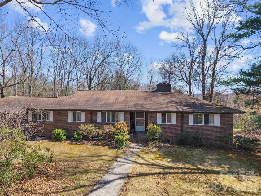 1086 Mine Gap Road, Zirconia, NC 28790.  MLS# CAR4361946, YatesRealty ID 6943. Front elvation from circle drive