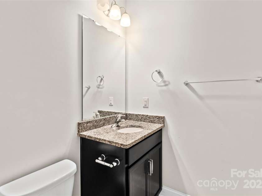 3023 Spinner Court, Denver, NC 28037.  MLS# CAR4142435, YatesRealty ID 6943. The guest bedroom on the main floor includes a full bathroom