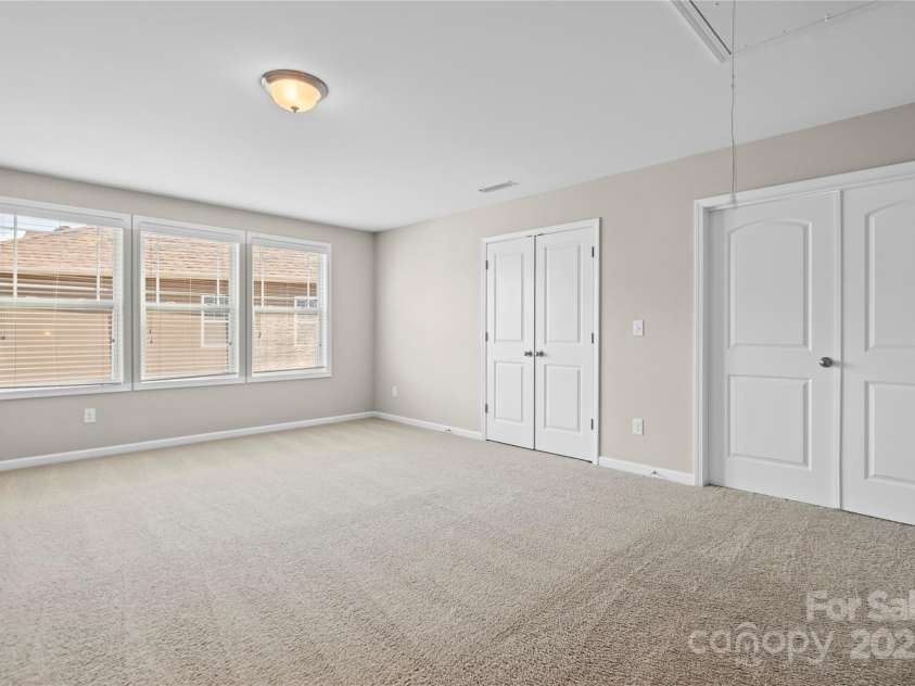 3023 Spinner Court, Denver, NC 28037.  MLS# CAR4142435, YatesRealty ID 6943. Upstairs, a spacious rec room awaits, offering endless possibilities for leisure and entertainment, making it the perfect retreat for family gatherings and casual relaxation.