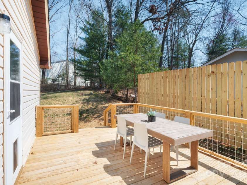 29 Evelake Drive, Asheville, NC 28806.  MLS# CAR4215759, YatesRealty ID 6945. Side Porch off Living/Dining with Privacy Fence