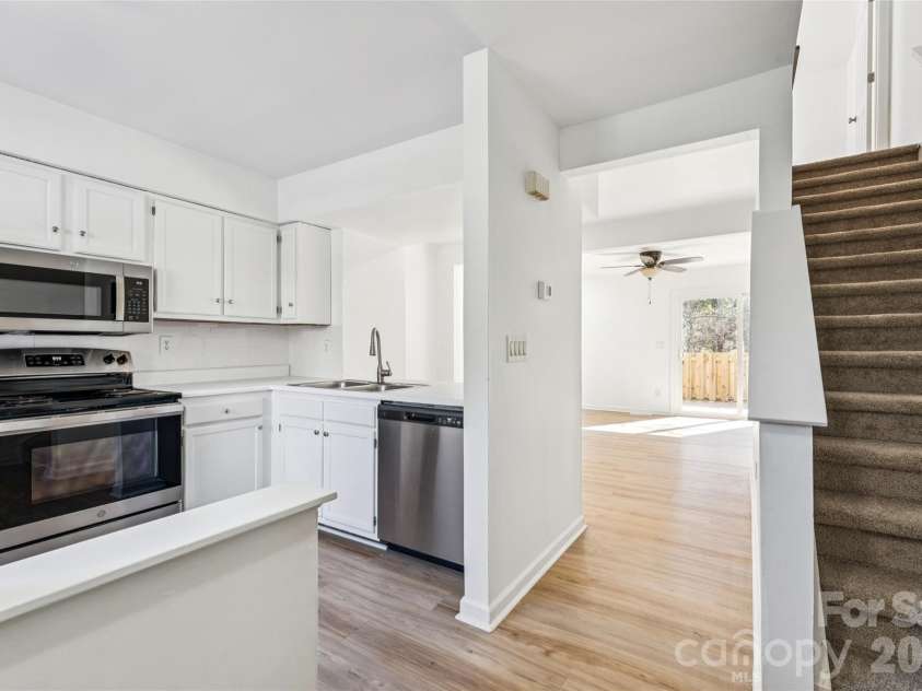 655 Lex Drive, Charlotte, NC 28262.  MLS# CAR4359903, YatesRealty ID 6951. Entrance, Kitchen and stairs to 2nd level