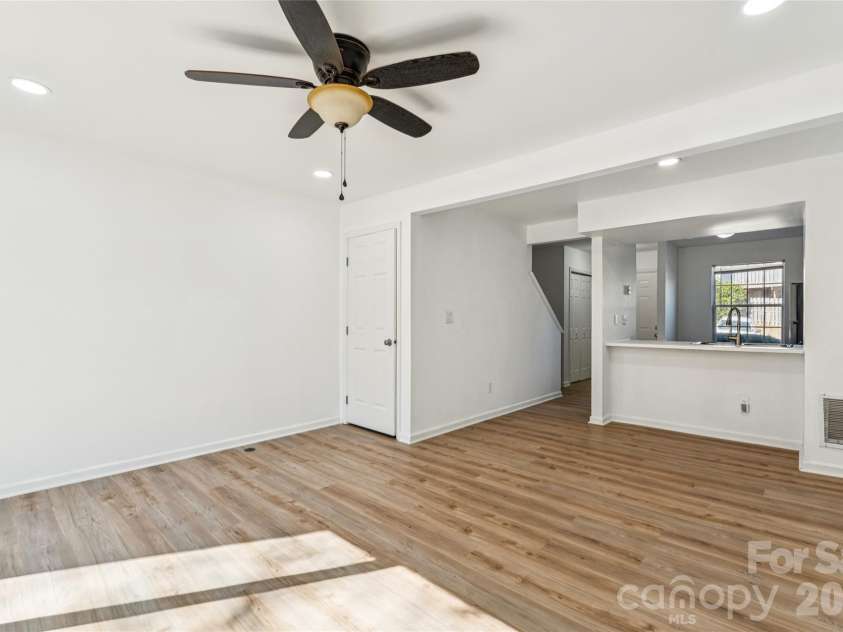 655 Lex Drive, Charlotte, NC 28262.  MLS# CAR4359903, YatesRealty ID 6951. Living room and dining area