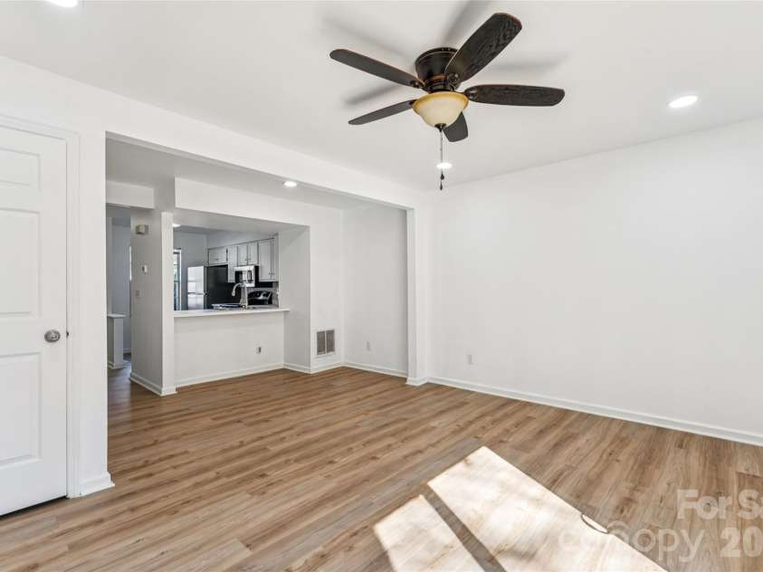 655 Lex Drive, Charlotte, NC 28262.  MLS# CAR4359903, YatesRealty ID 6951. Living room and dining area