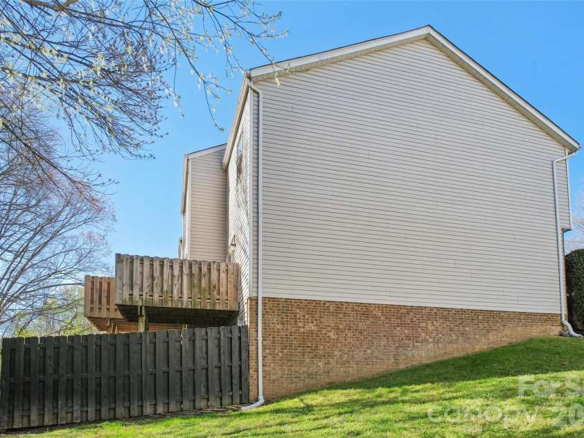 655 Lex Drive, Charlotte, NC 28262.  MLS# CAR4359903, YatesRealty ID 6951. Side of end unit