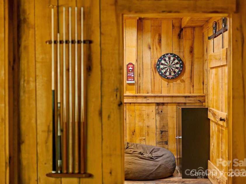 501 Bolt Road, Lake Lure, NC 28746.  MLS# CAR4241628, YatesRealty ID 6962. Fun for all in the lower-level rec room