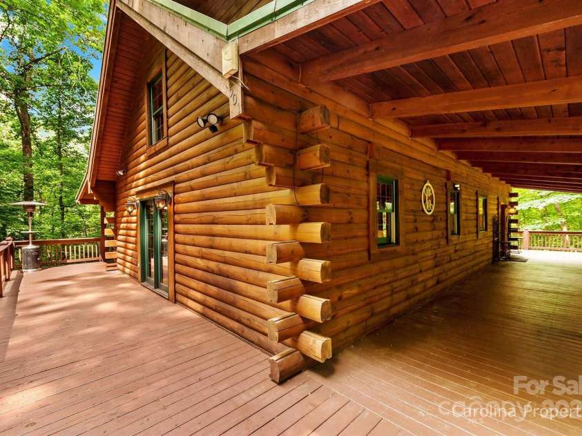 501 Bolt Road, Lake Lure, NC 28746.  MLS# CAR4241628, YatesRealty ID 6962. Lots of porch space