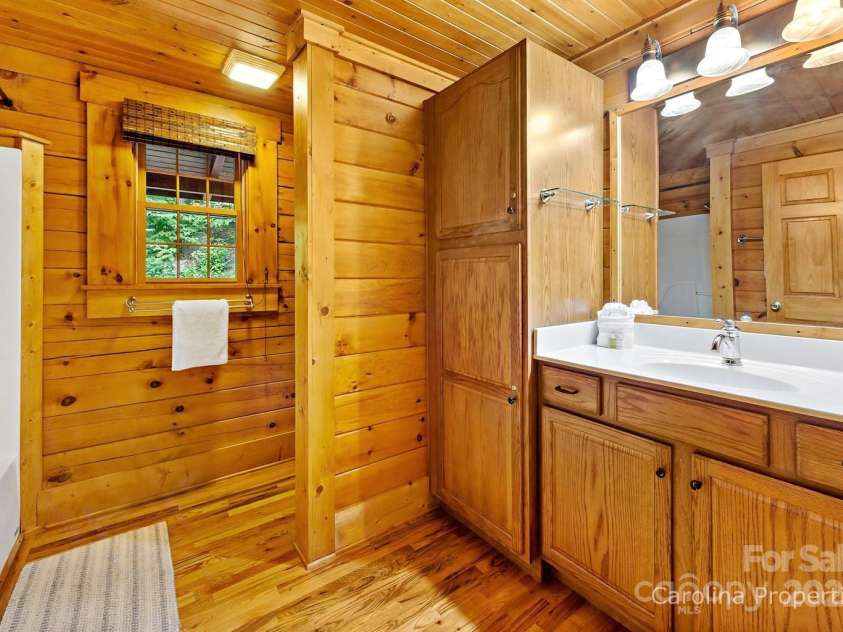 501 Bolt Road, Lake Lure, NC 28746.  MLS# CAR4241628, YatesRealty ID 6962. Main level ensuite bath