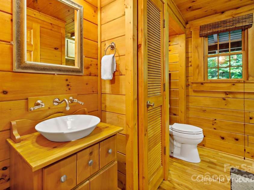 501 Bolt Road, Lake Lure, NC 28746.  MLS# CAR4241628, YatesRealty ID 6962. Main level Half bath in the hall