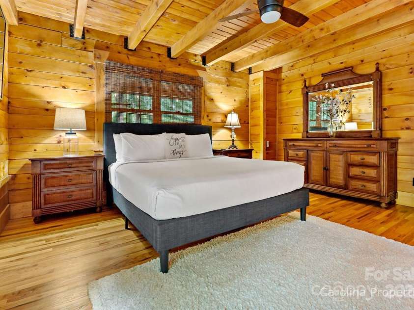 501 Bolt Road, Lake Lure, NC 28746.  MLS# CAR4241628, YatesRealty ID 6962. Main level primary bedroom