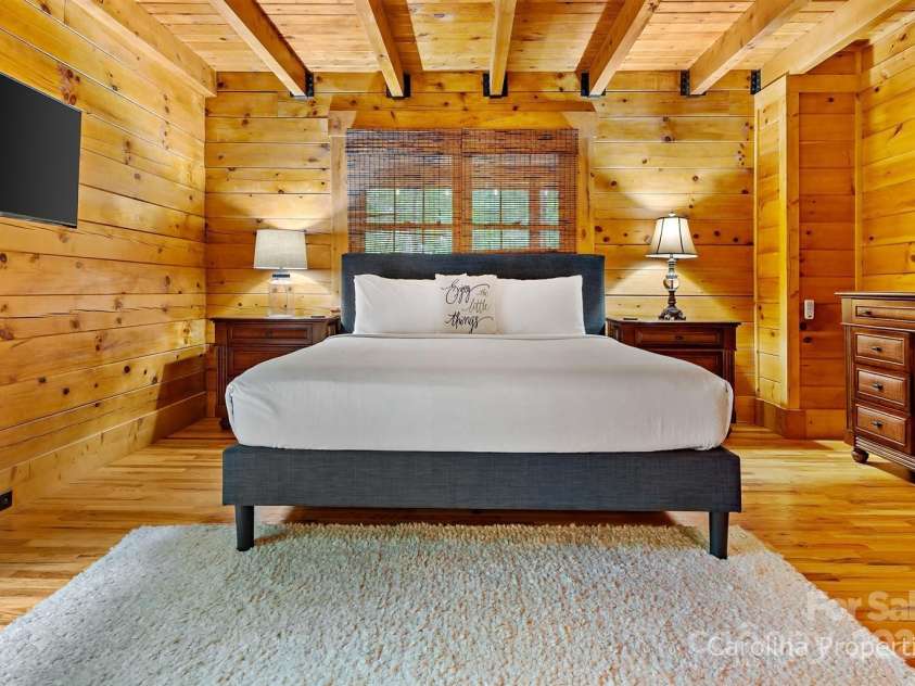501 Bolt Road, Lake Lure, NC 28746.  MLS# CAR4241628, YatesRealty ID 6962. Main level primary bedroom