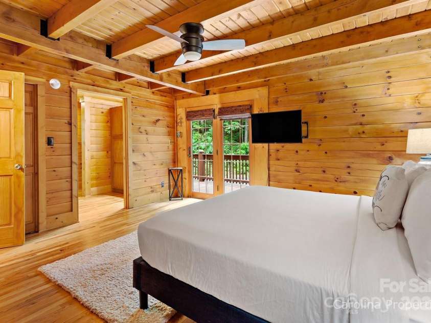 501 Bolt Road, Lake Lure, NC 28746.  MLS# CAR4241628, YatesRealty ID 6962. Main level primary bedroom