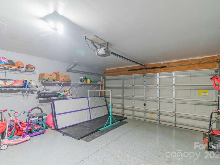 552 Montgomery Drive, Rock Hill, SC 29732.  MLS# CAR4233355, YatesRealty ID 6964. Garage with shelves and epoxy flooring