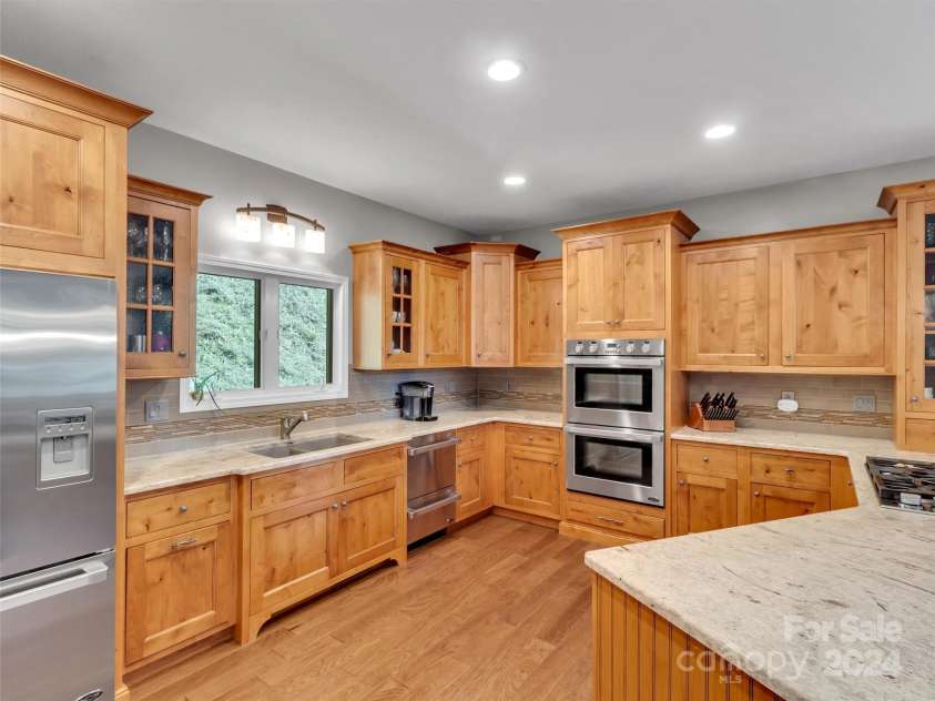 2525 Eagles Nest Road, Waynesville, NC 28786.  MLS# CAR4167928, YatesRealty ID 697. Chef's Kitchen with Double Ovens & Double Dishwashers