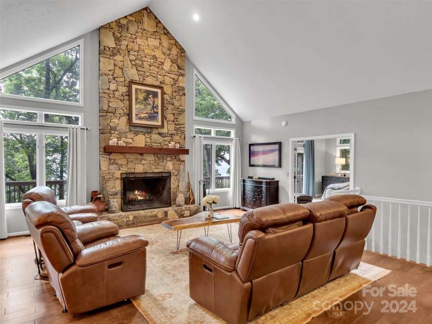 2525 Eagles Nest Road, Waynesville, NC 28786.  MLS# CAR4167928, YatesRealty ID 697. Floor to Ceiling Stone Fireplace