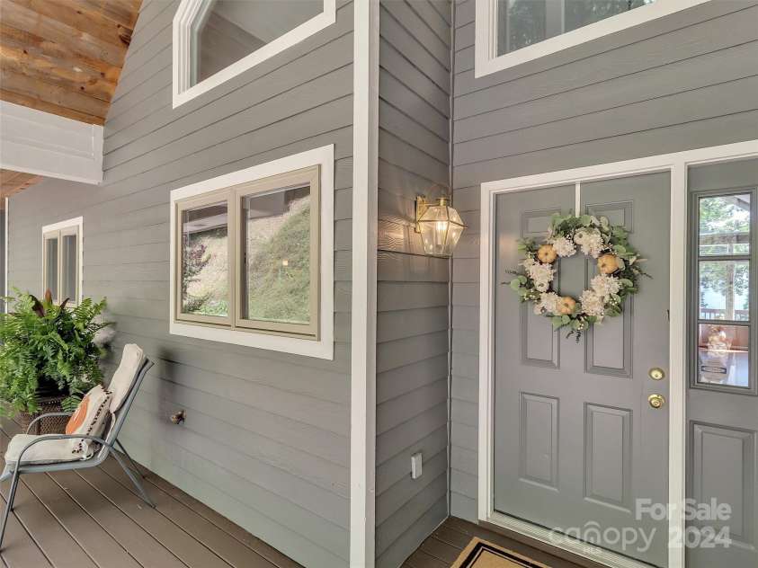 2525 Eagles Nest Road, Waynesville, NC 28786.  MLS# CAR4167928, YatesRealty ID 697. Inviting Covered Porch