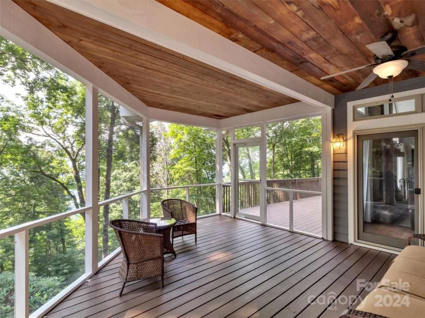 2525 Eagles Nest Road, Waynesville, NC 28786.  MLS# CAR4167928, YatesRealty ID 697. Relax on the Screened Porch