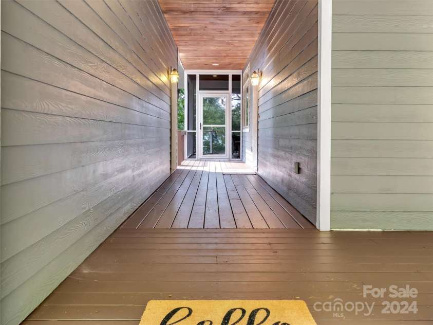 2525 Eagles Nest Road, Waynesville, NC 28786.  MLS# CAR4167928, YatesRealty ID 697. Walkway to Screened Porch or Kitchen Entrance