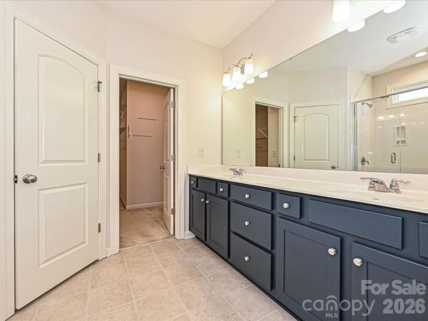 2004 Rockbrook Lane, Belmont, NC 28012.  MLS# CAR4355401, YatesRealty ID 6972. Primary Bath suite with double vanity