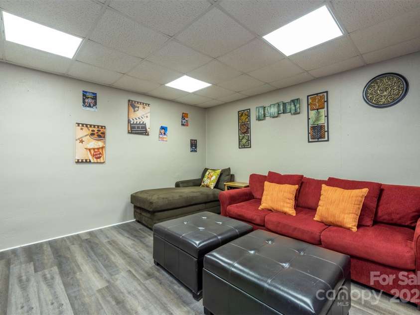 192 Buzzards Place, Lake Lure, NC 28746.  MLS# CAR4235753, YatesRealty ID 6985. Basement Media Room
