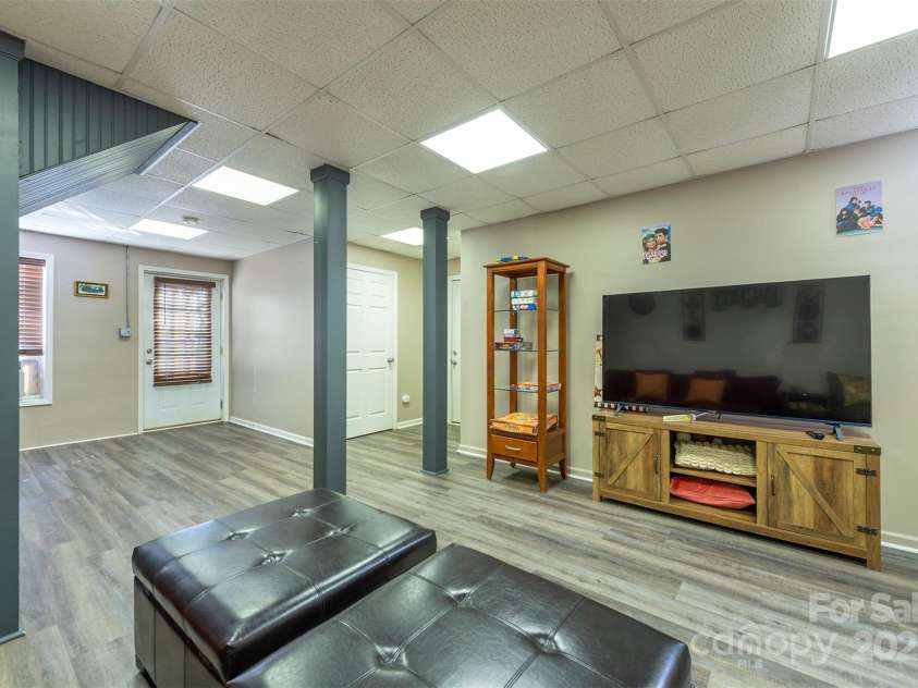 192 Buzzards Place, Lake Lure, NC 28746.  MLS# CAR4235753, YatesRealty ID 6985. Basement Media Room