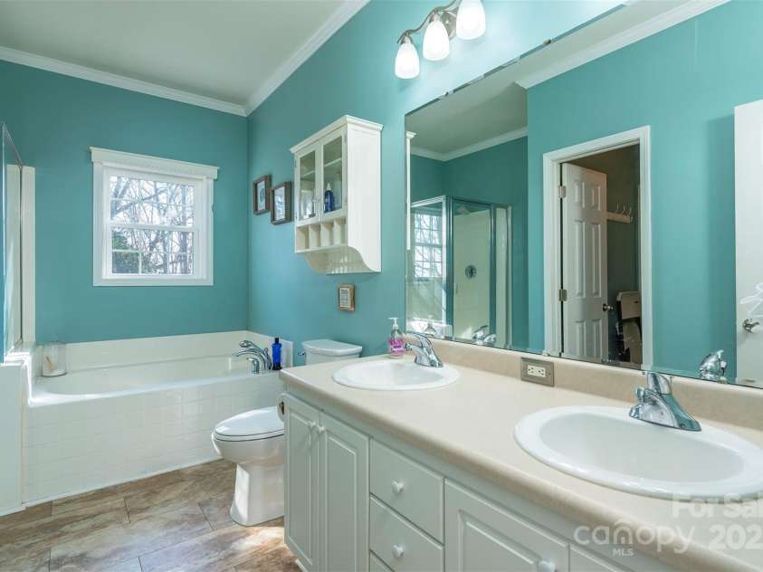 192 Buzzards Place, Lake Lure, NC 28746.  MLS# CAR4235753, YatesRealty ID 6985. Primary En-suite bathroom Level 1