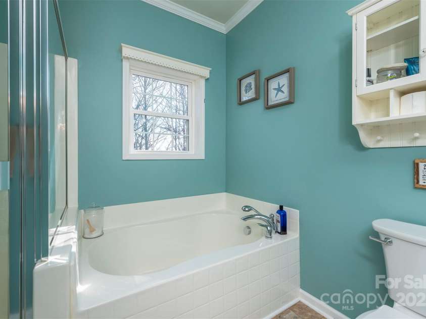 192 Buzzards Place, Lake Lure, NC 28746.  MLS# CAR4235753, YatesRealty ID 6985. Primary En-suite bathroom Level 1